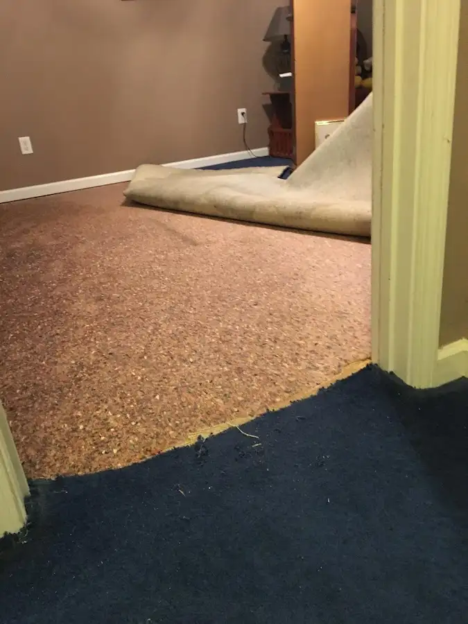Carpet pad removal revealing water damage during Drying & Dehumidification in Granite Bay